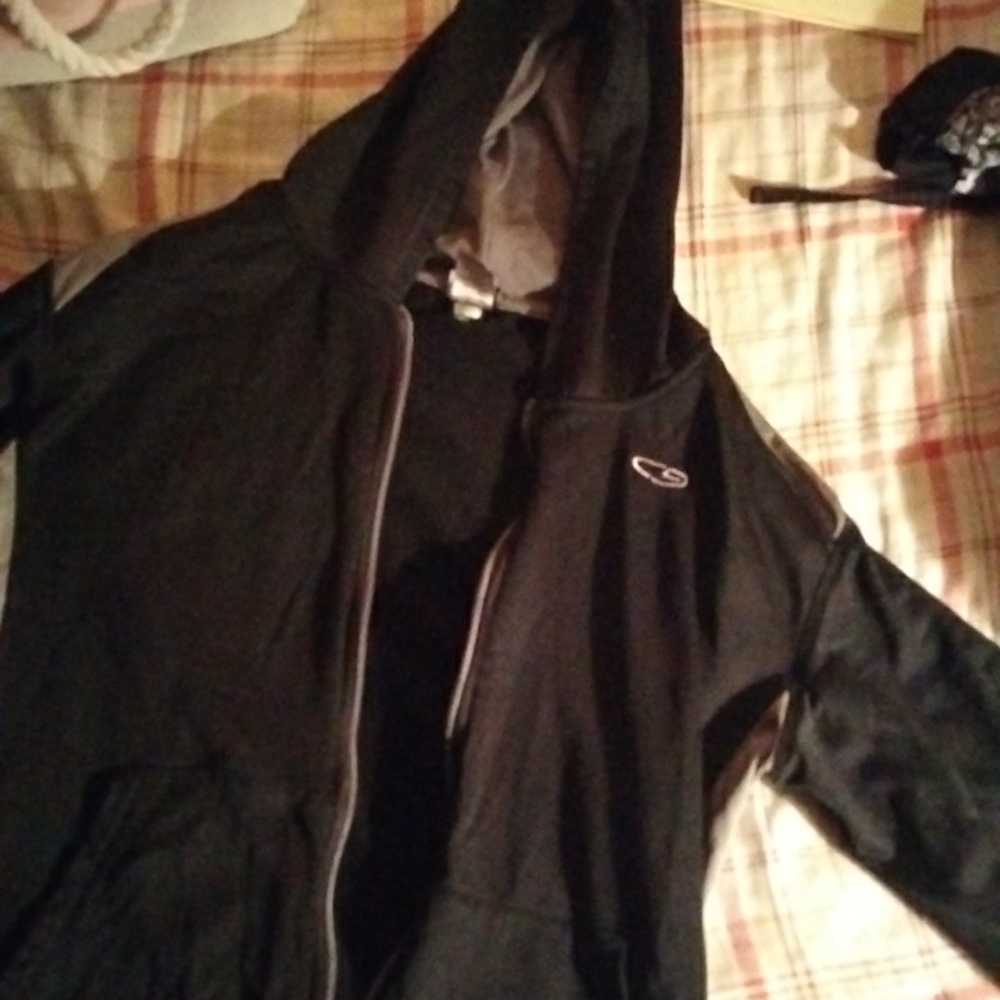 A black and gray champion jacket the color is black and gray the size is XL 16